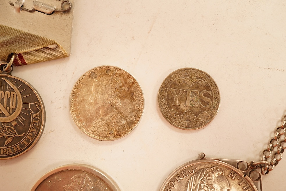 World coins, Victoria, 1891 crown, mounted with chain, Austria, Maria Theresa Thaler, mounted, CCCP medal award, a pierced one rupee India eighteen ninety and a novelty yes no fantasy coin.